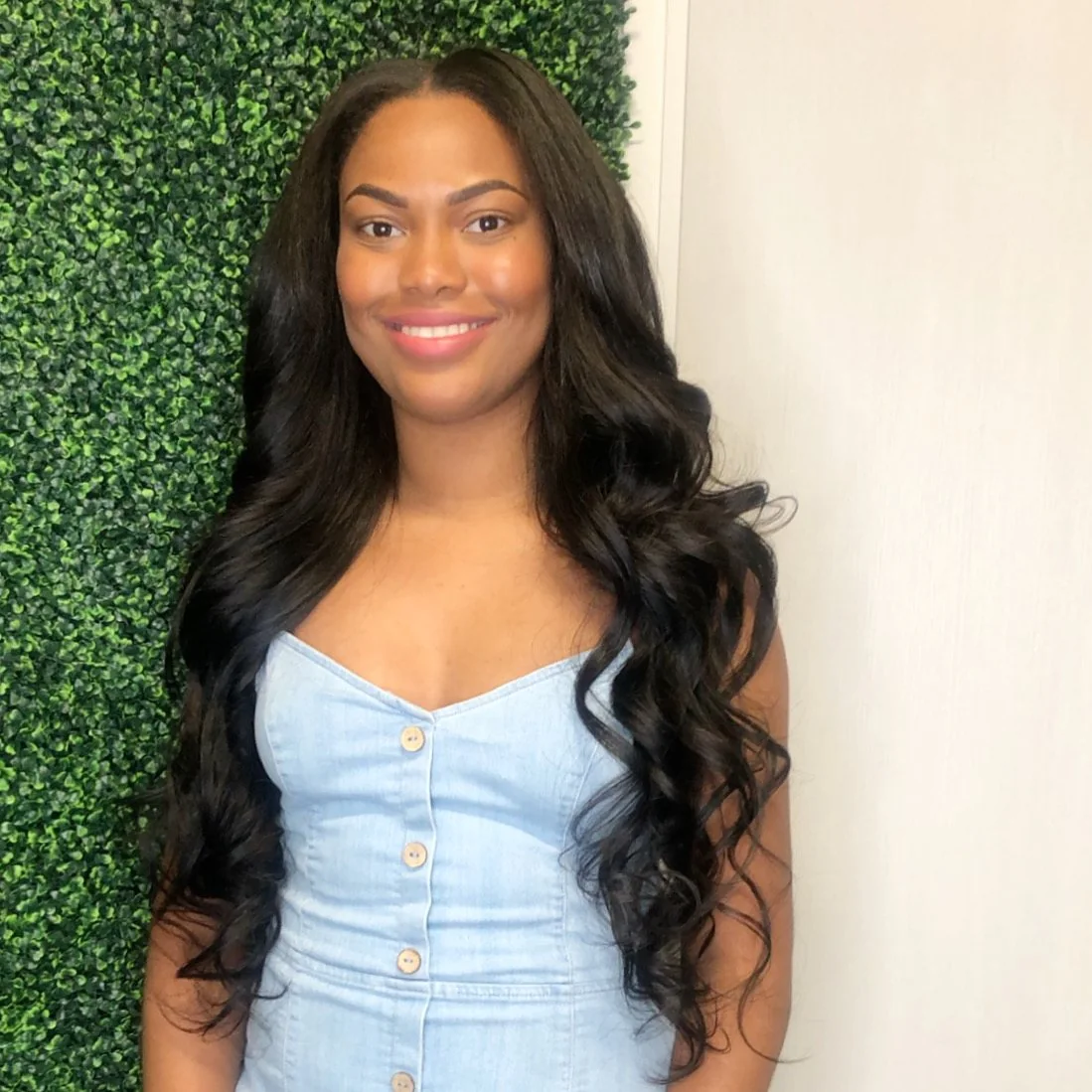 Seamless sew-in hair extensions with soft curls in Dallas, Texas.